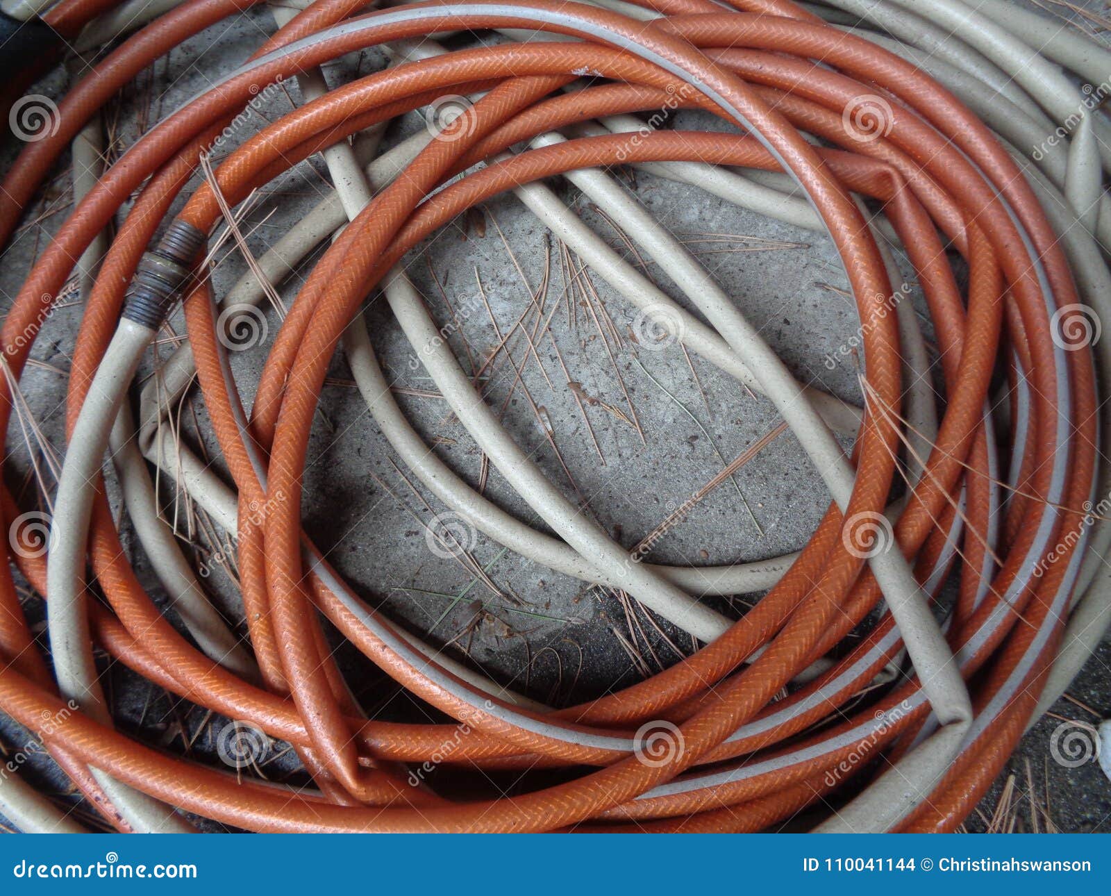 https://thumbs.dreamstime.com/z/hose-reel-against-concrete-image-shows-beige-orange-coiled-up-laying-ground-could-be-used-to-represent-water-110041144.jpg