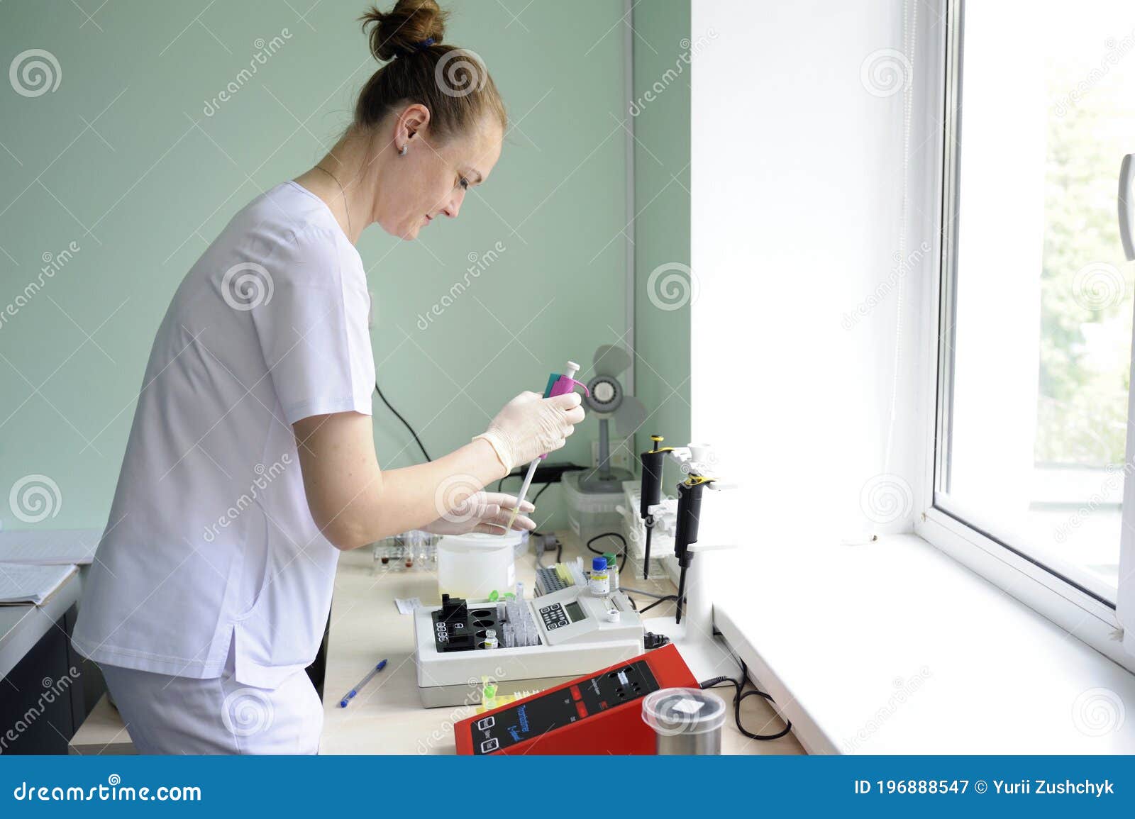 At a Hospital Laboratory. Lab Technician Performing Analysis of Blood