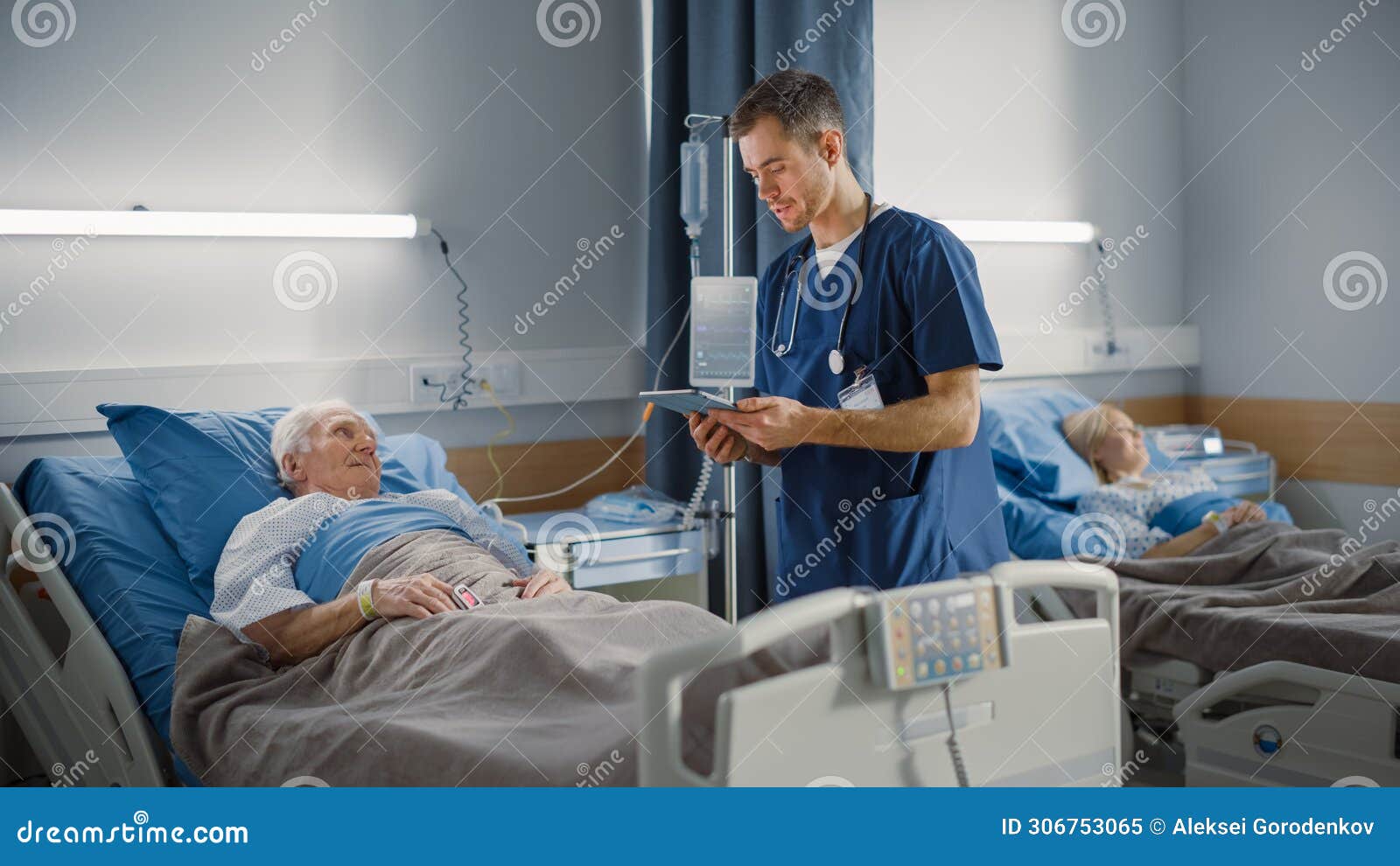 hospital ward: friendly male nurse talks reassuringly to elderly patient resting in bed. doctor us