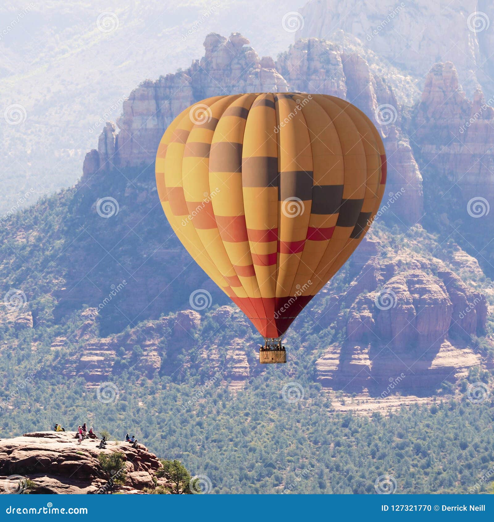 a hot air balloon soars near sedona, arizona