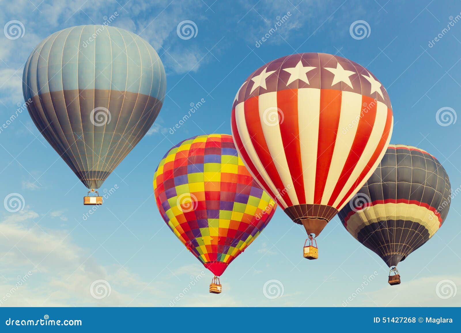 hot air balloons flying over blue sky