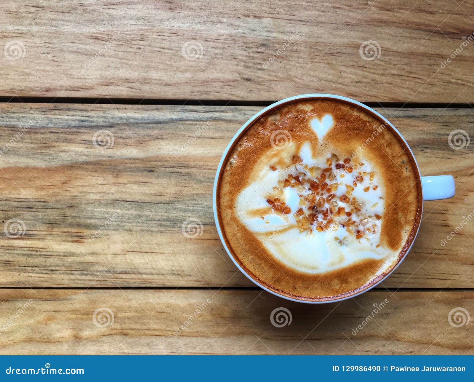 Download Hot Cappuccino Coffee In White Cup With Brown Cane Sugar Topping On Wooden Table Background ...