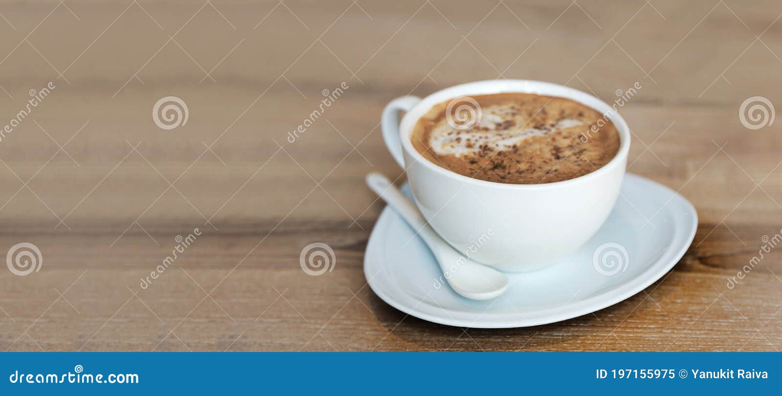 hot cappucinno serve on wood table