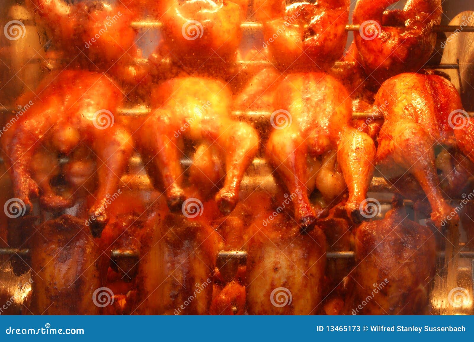 Hot chicken in a grill stock image. Image of machine 13465173