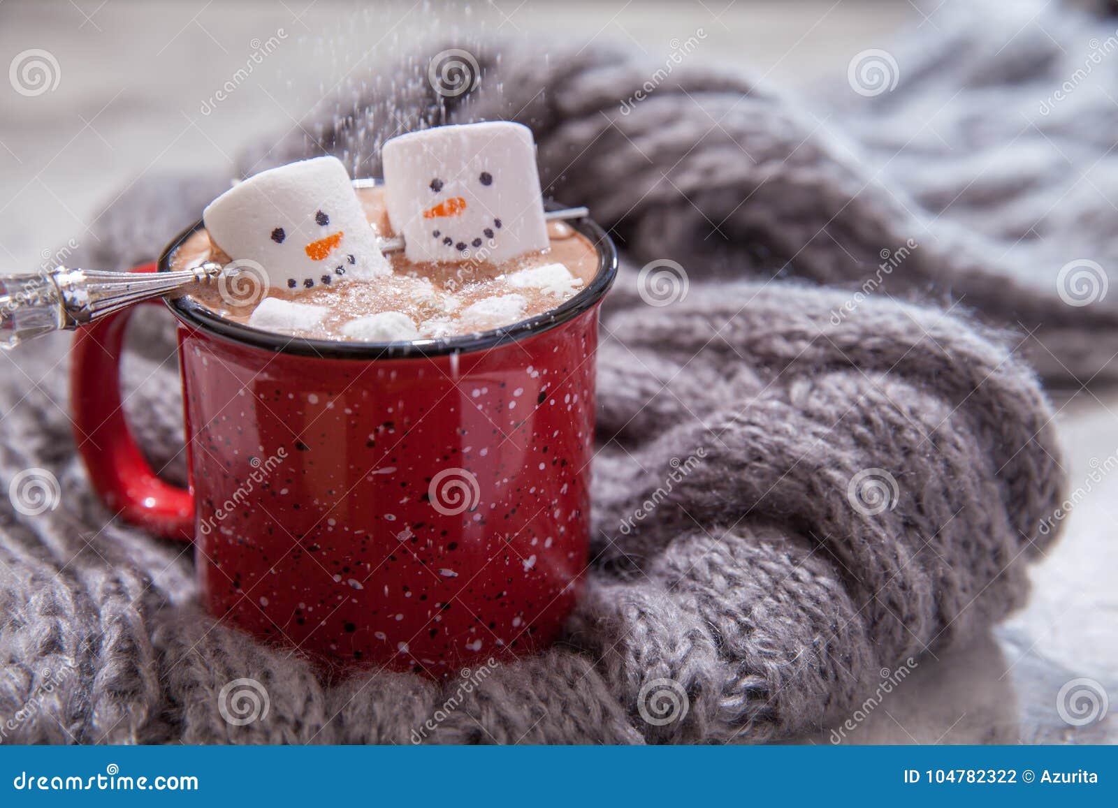 Red thermos next cup with hot chocolate with marshmallows on table with  snow outside Stock Photo - Alamy