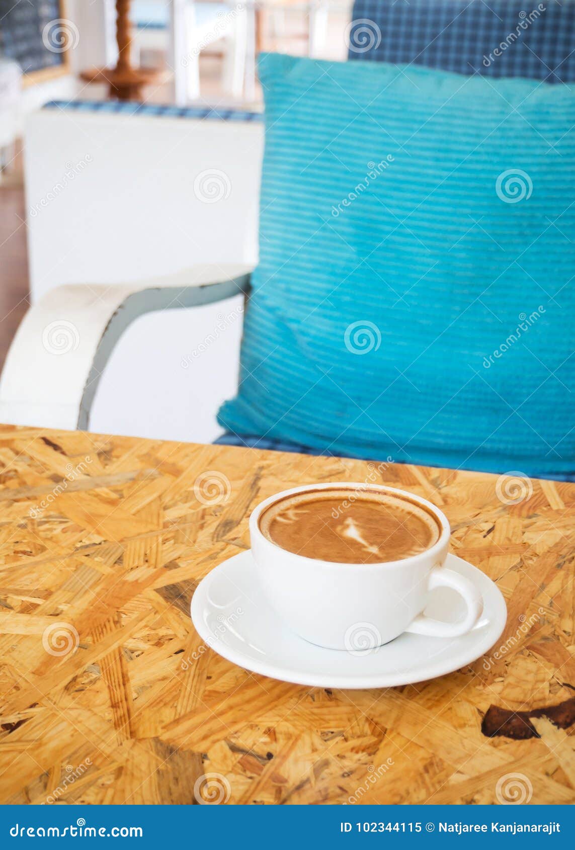 hot coffee cup on wooden table. cafe view.