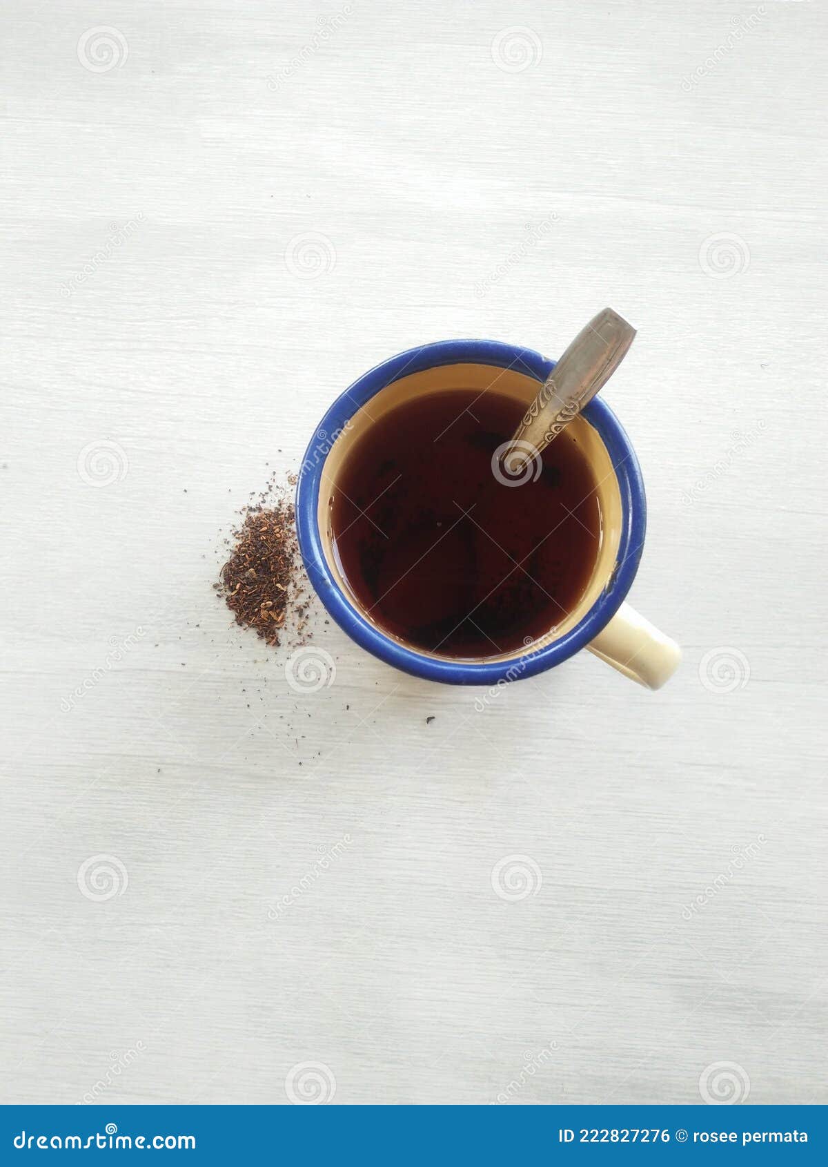 Hot Tea in a Metal Cup with Tea Powder on the Side Stock Photo Image
