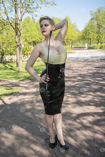 Hot Curvy Woman With Short Hair And Big Boobs Wearing Latex Kinky Secretary Dress With Feitsh