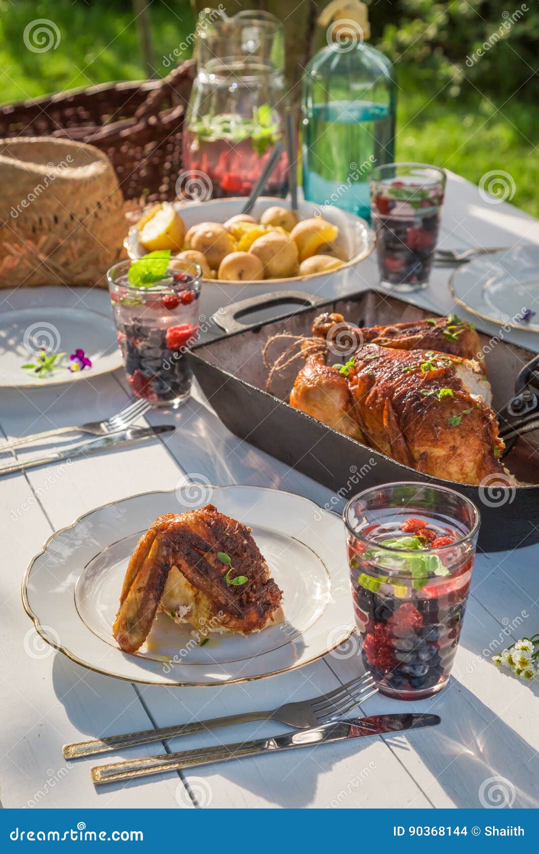 Hot Dinner with Chicken and Potatoes Served in Sunny Day Stock Photo