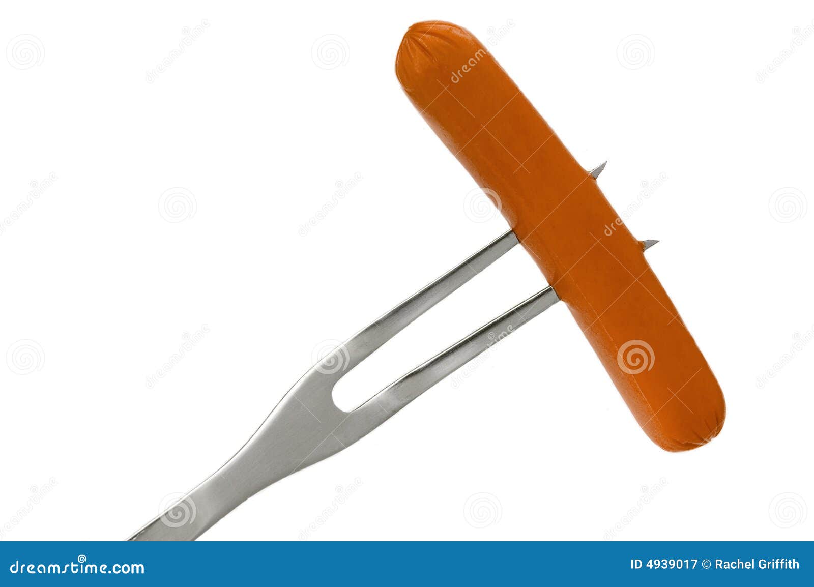 Hot Dog On A Fork Ready For The Grill Royalty Free Stock Photography