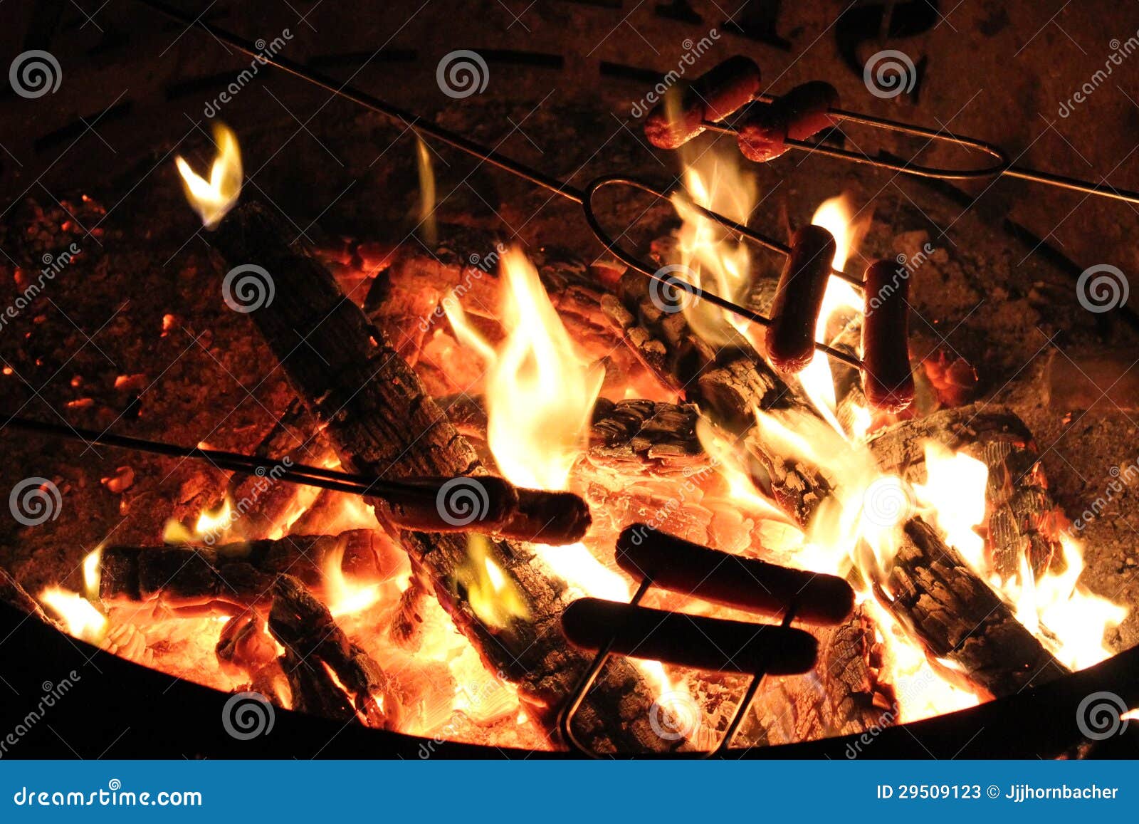 Hot Dogs over the campfire stock image. Image of cooking 29509123
