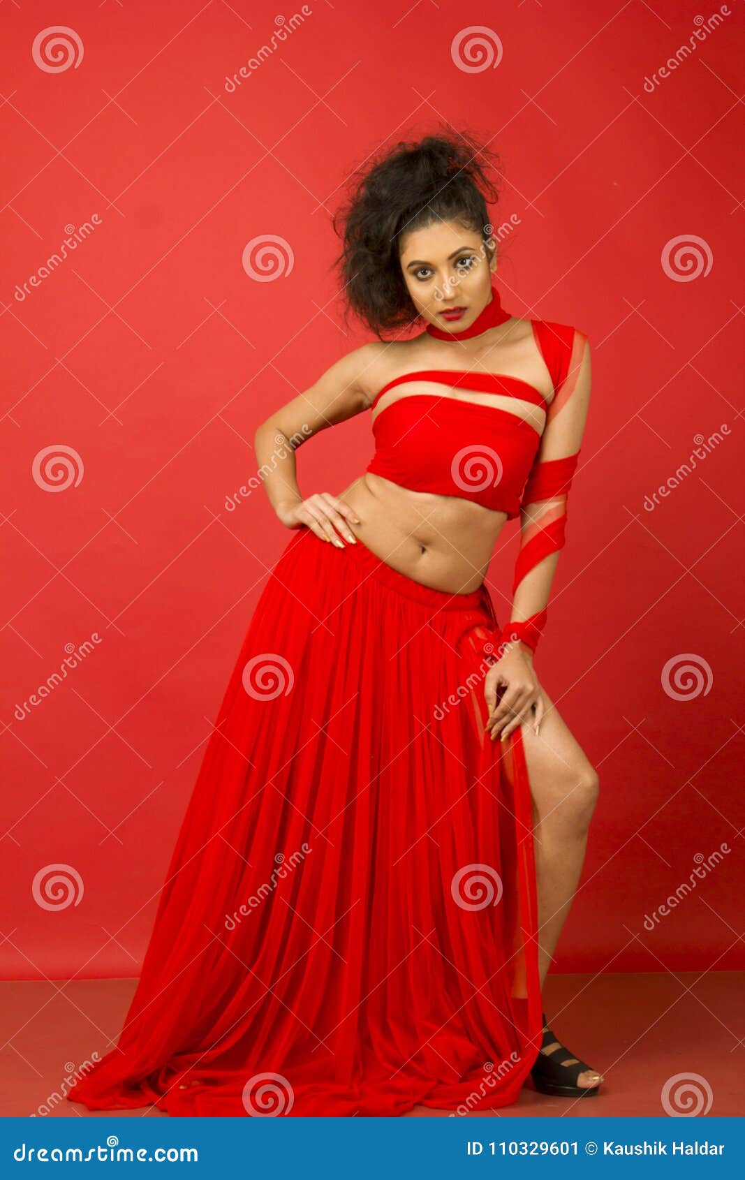 Beautiful Female Model in a Flowy Red ...