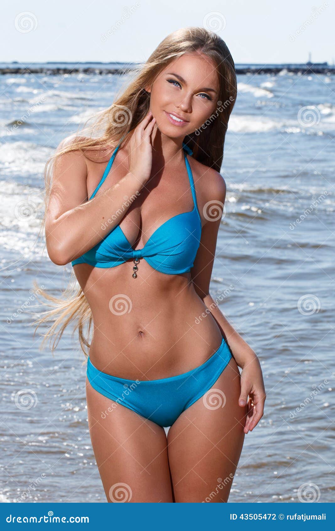 Hot girl on the beach stock photo