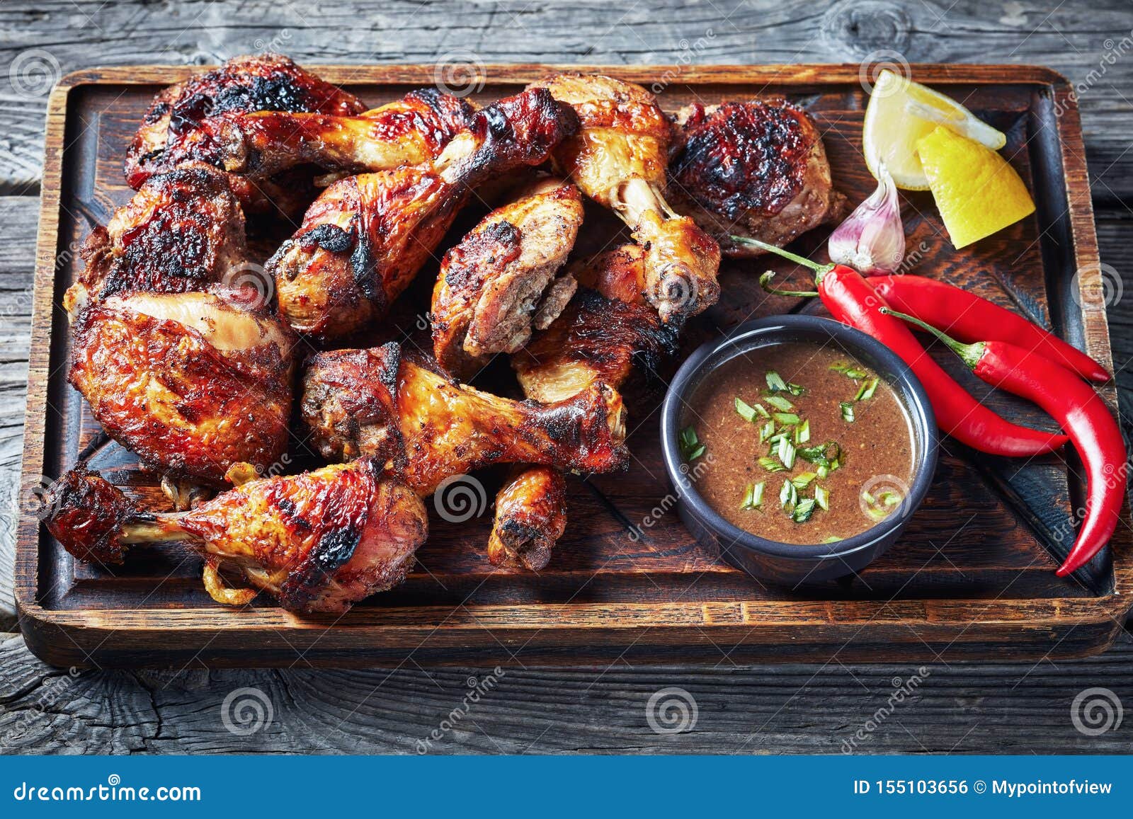 hot grilled jamaican jerk chicken on a board