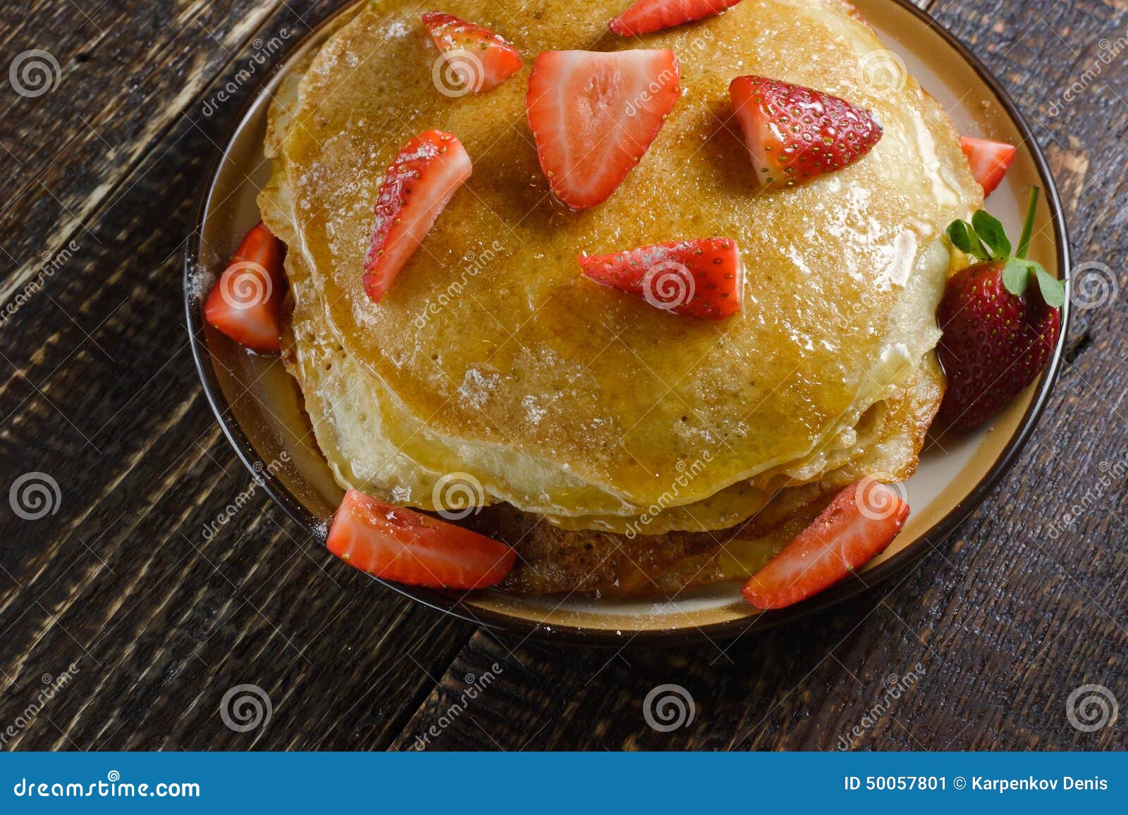 Hot Pancakes with Strawberries and Honey on the Ceramic Plate Stock