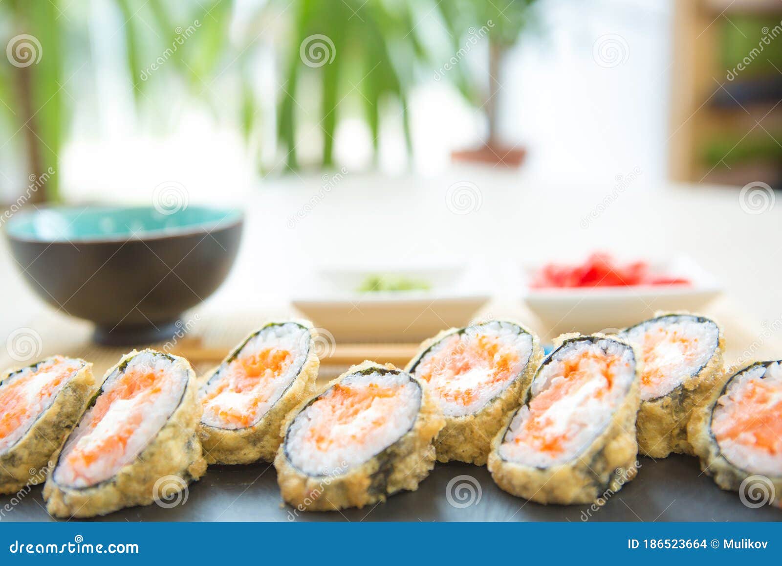 Hot Roll with Cream Cheese. Deep Fried Salmon Outside Stock Photo