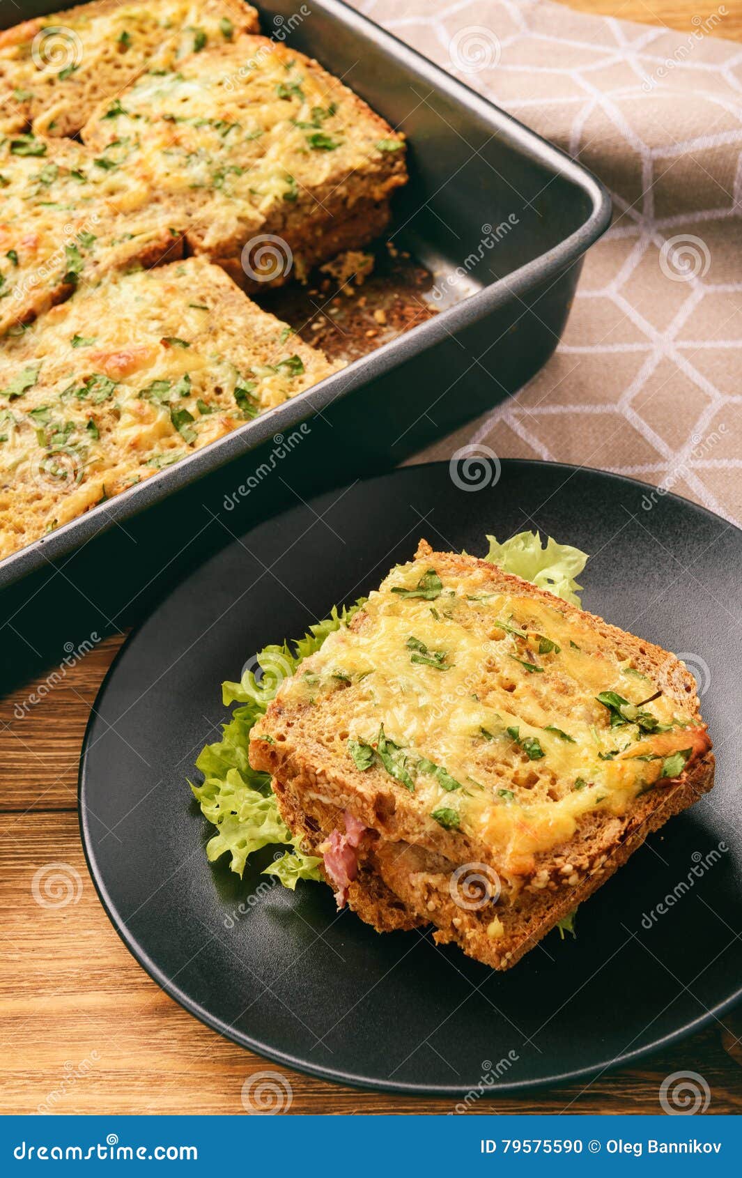 Hot Sandwiches Bread Baked in Oven with Ham and Cheese. Stock Photo