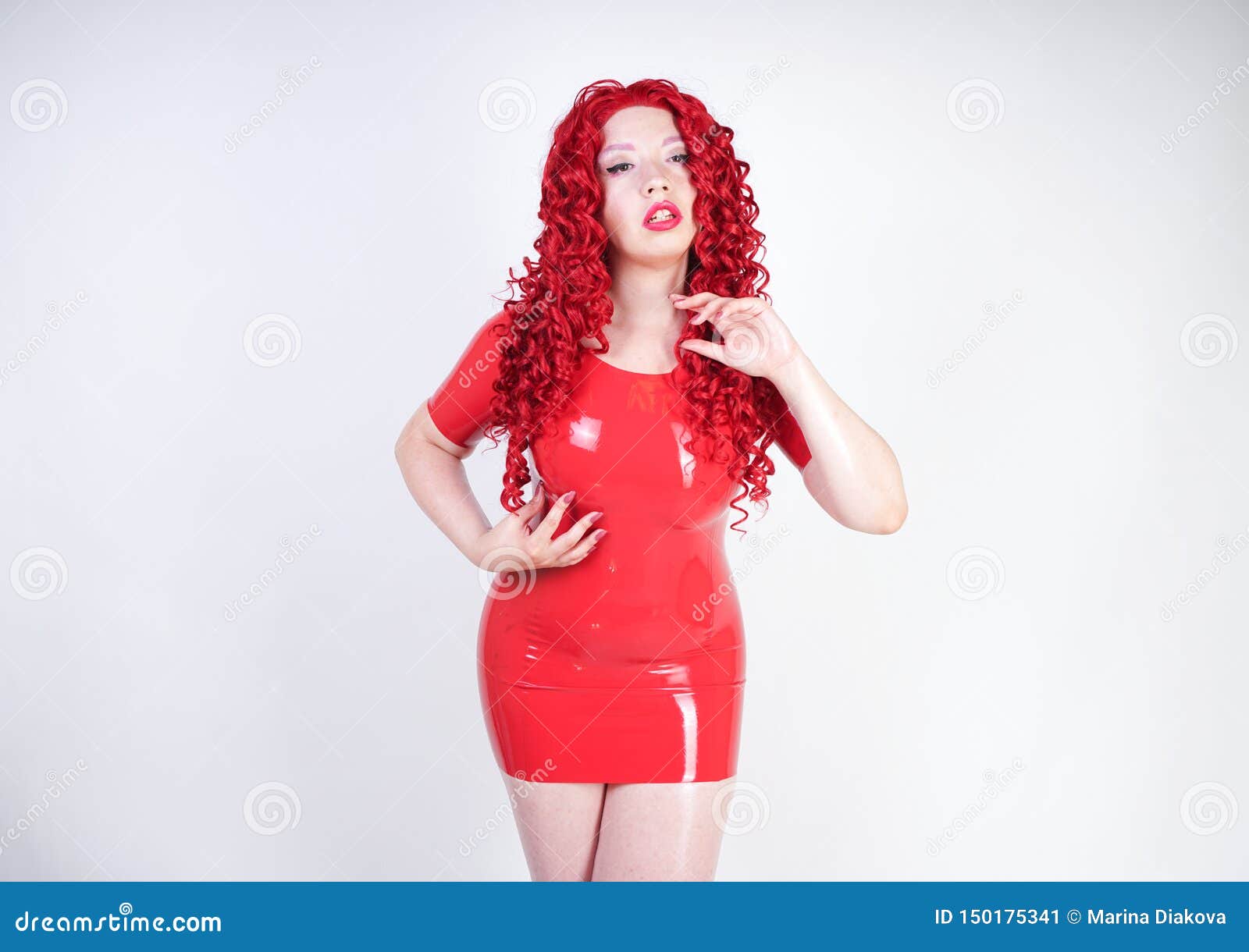 Hot Sexual Redheaded Girl with Plus Size Body Wears Fashion Latex Rubber  Red Dress and Posing on White Studio Background Alone. Ch Stock Image -  Image of leather, kinky: 150175341