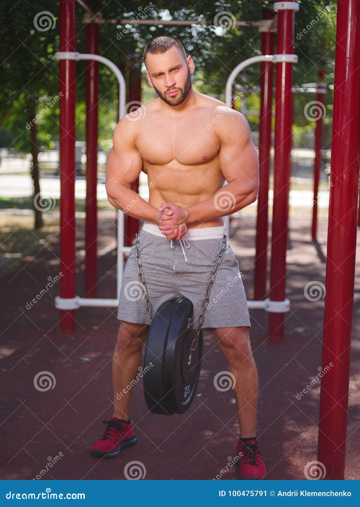Strong and Handsome Young Man with Perfect Body Doing Exercise picture image picture