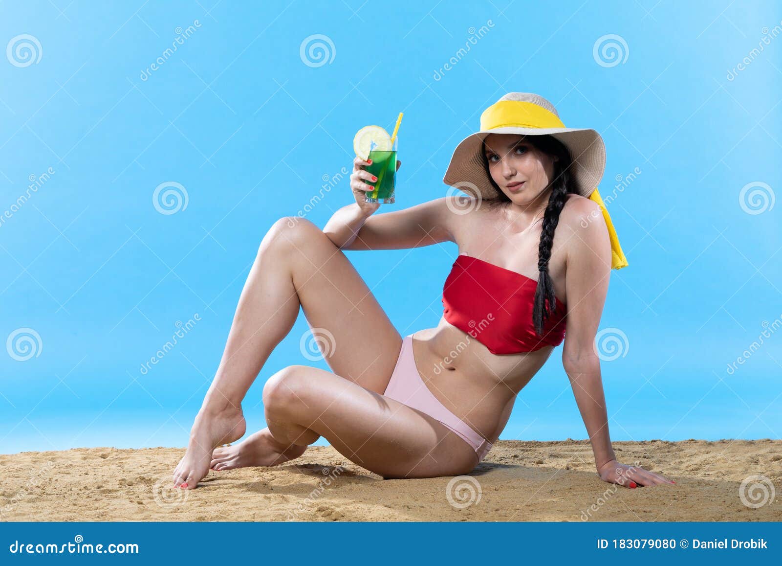 Teen Sitting While Sipping A Cold Alcoholic Drink While Enjoying The