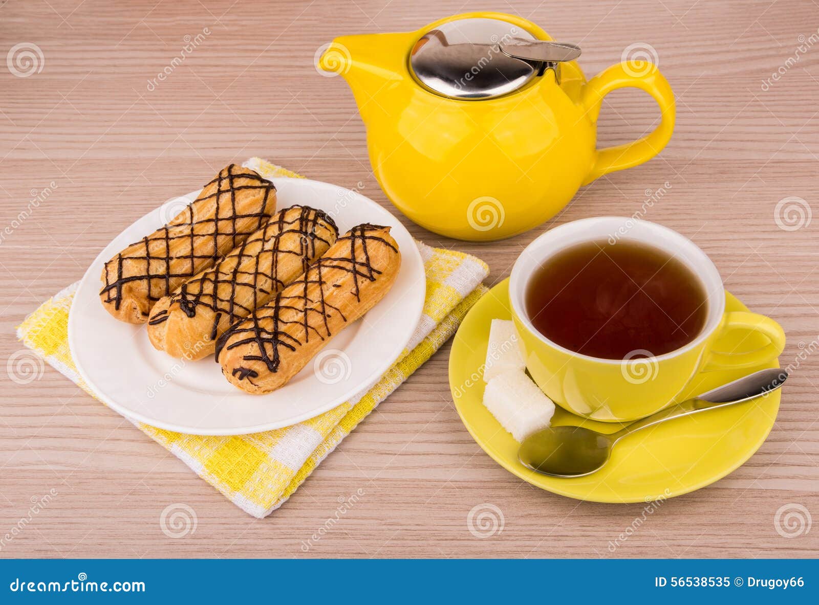Hot Tea in Cup, Teapot and Eclairs on Table Stock Image Image of black, sugar 56538535