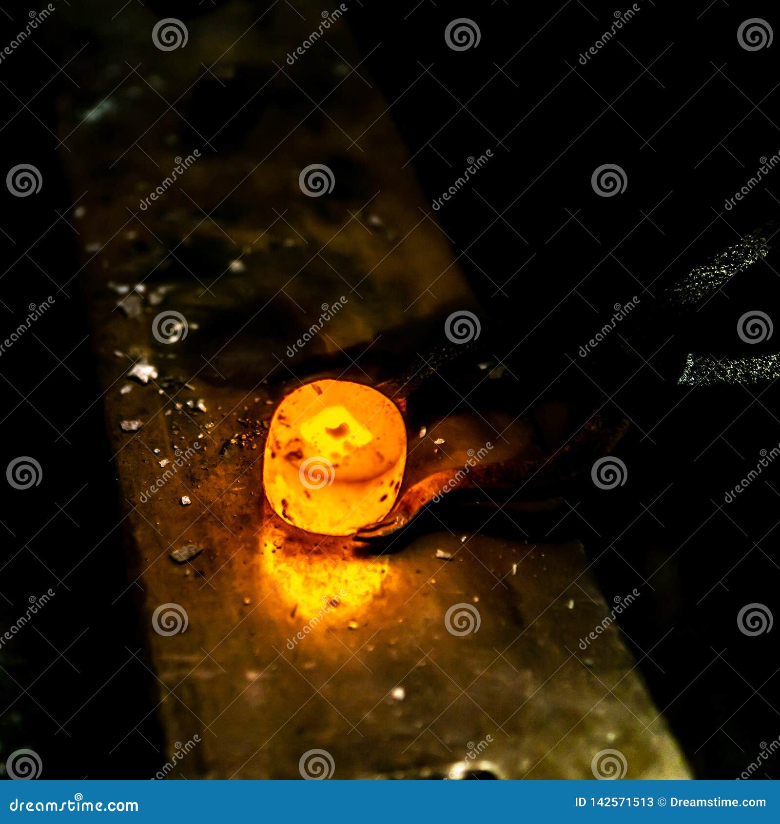 Hot Und Glow Iron Workpiece during Work in a Blacksmith. Stock Image