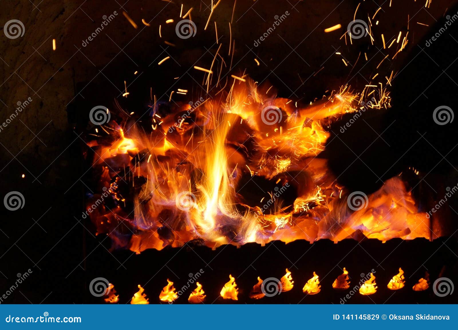 Hot Wood Coals Burn with Bright Flame in Iron Brazier Stock Image