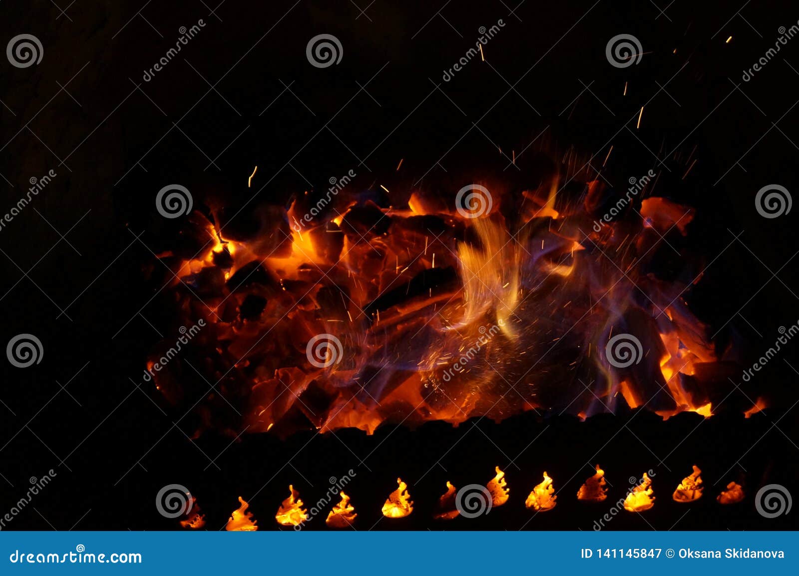 Hot Wood Coals Burn with Bright Flame in Iron Brazier Stock Image
