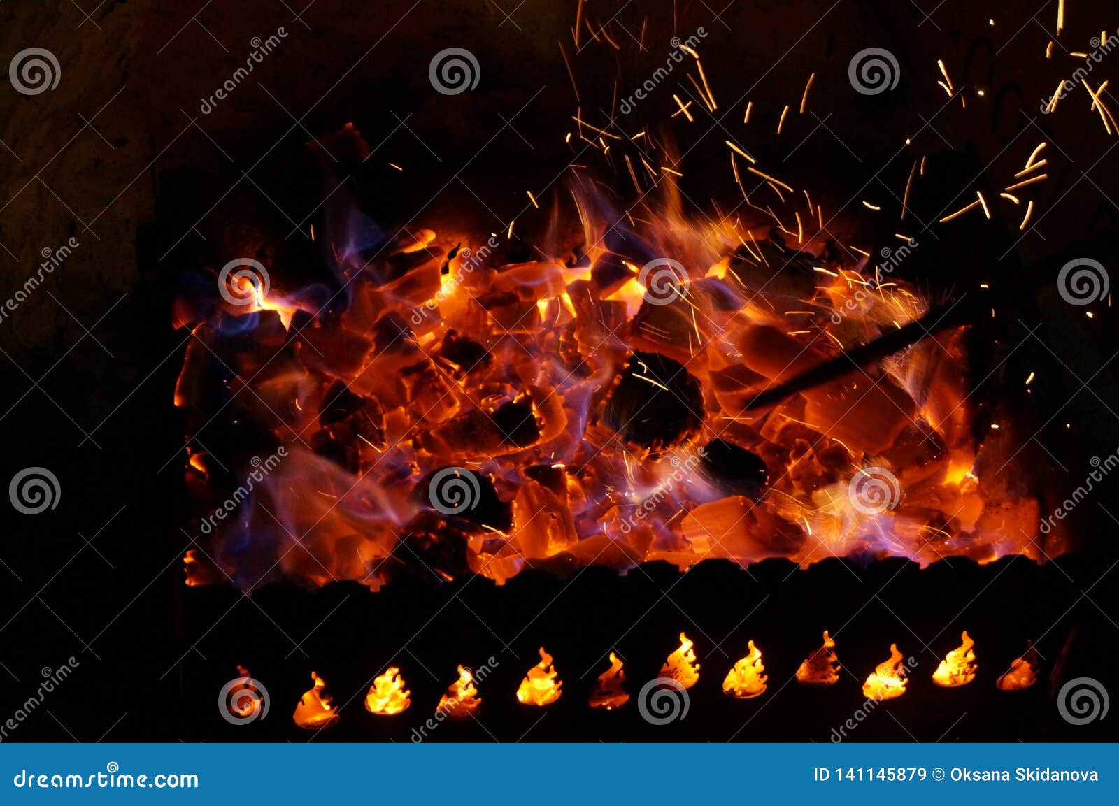 Hot Wood Coals Burn with Bright Flame in Iron Brazier Stock Image