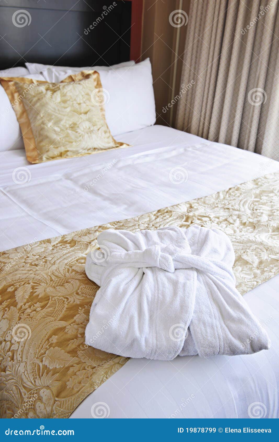 Hotel bed with bathrobe stock image. Image of inviting 19878799