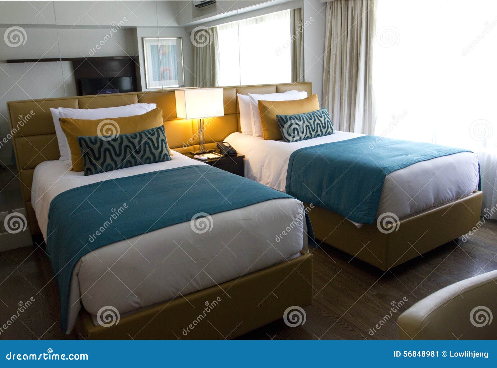 Hotel bedroom stock image. Image of deluxe, bedroom, beds 56848981