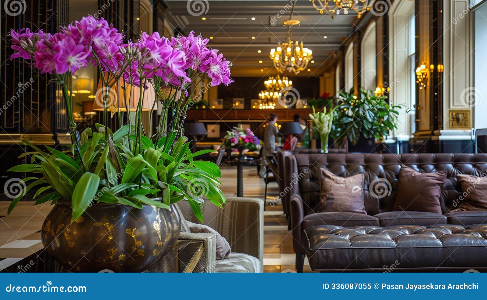 hotel lobby featuring plush seating and flowers