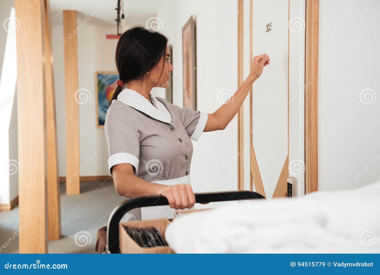 hotel maid knocking on the hotel door for room service