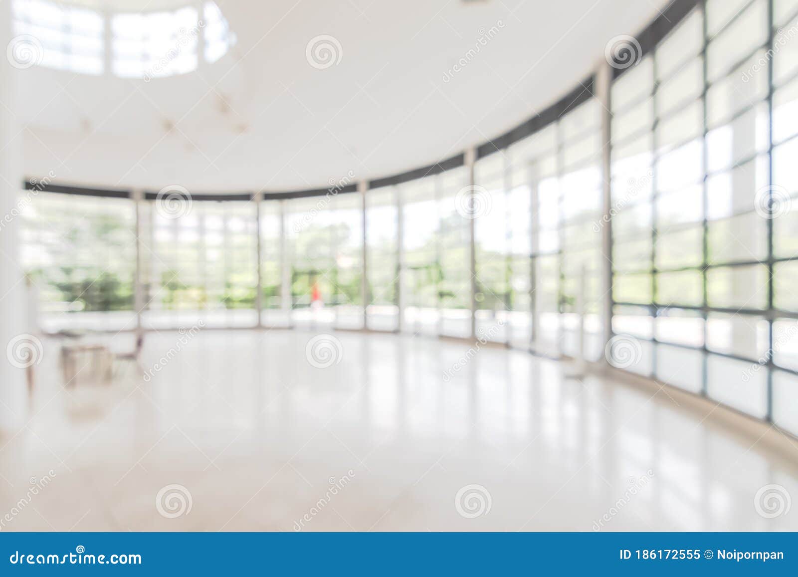 hotel or office building lobby blur background interior view toward reception hall, modern luxury white room space with blurry