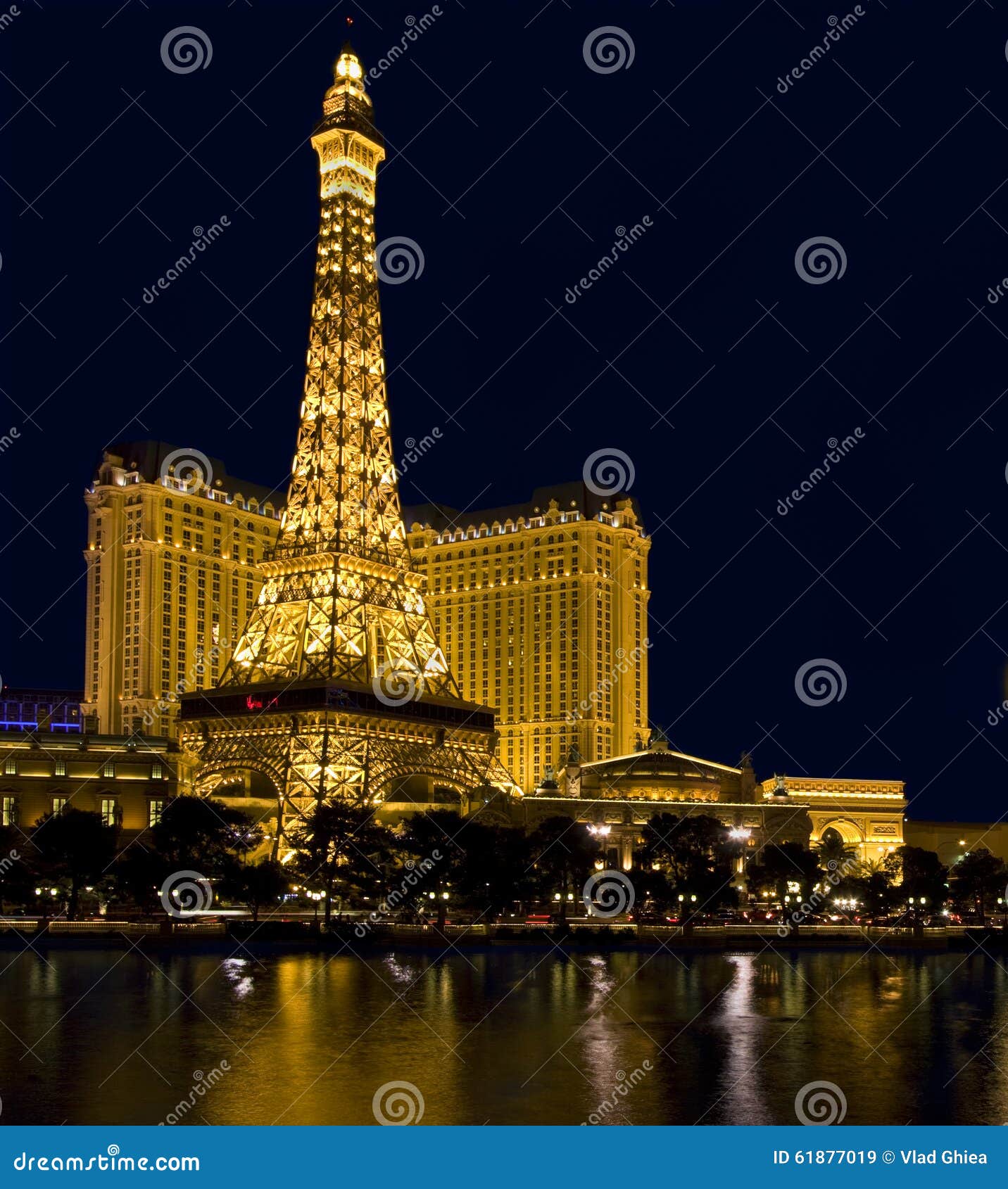 Hotel Paris and Replica of Eiffel Tower at Night in Las Vegas