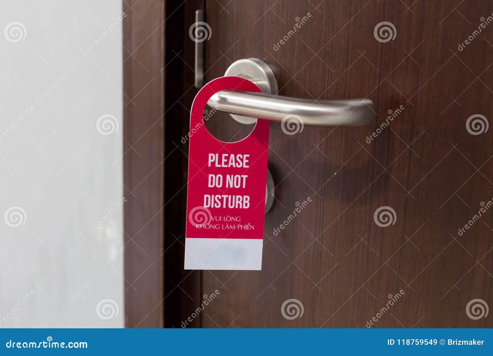 the hotel room with do not disturb sign on the door.