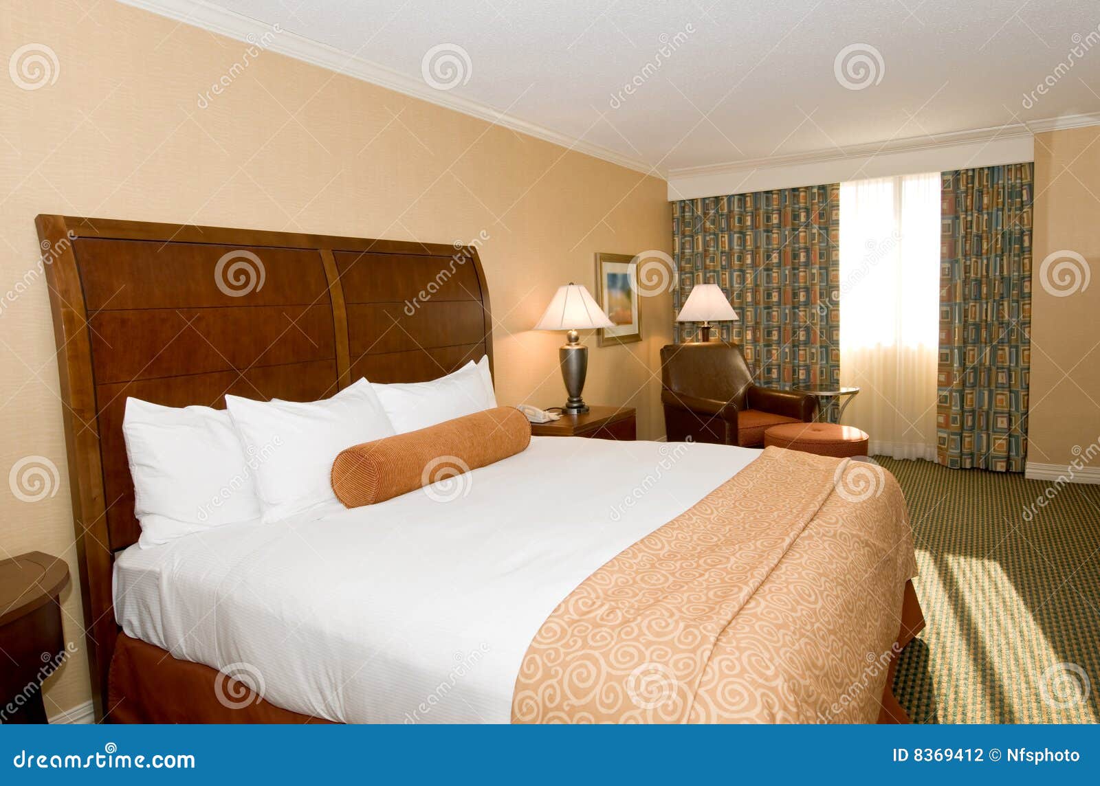 Hotel room with queen bed stock photo. Image of blanket 