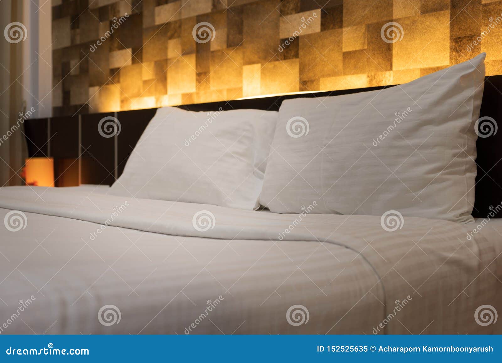 Hotel Room Service Hands Set Up White Pillow on the Bed in the Hotel