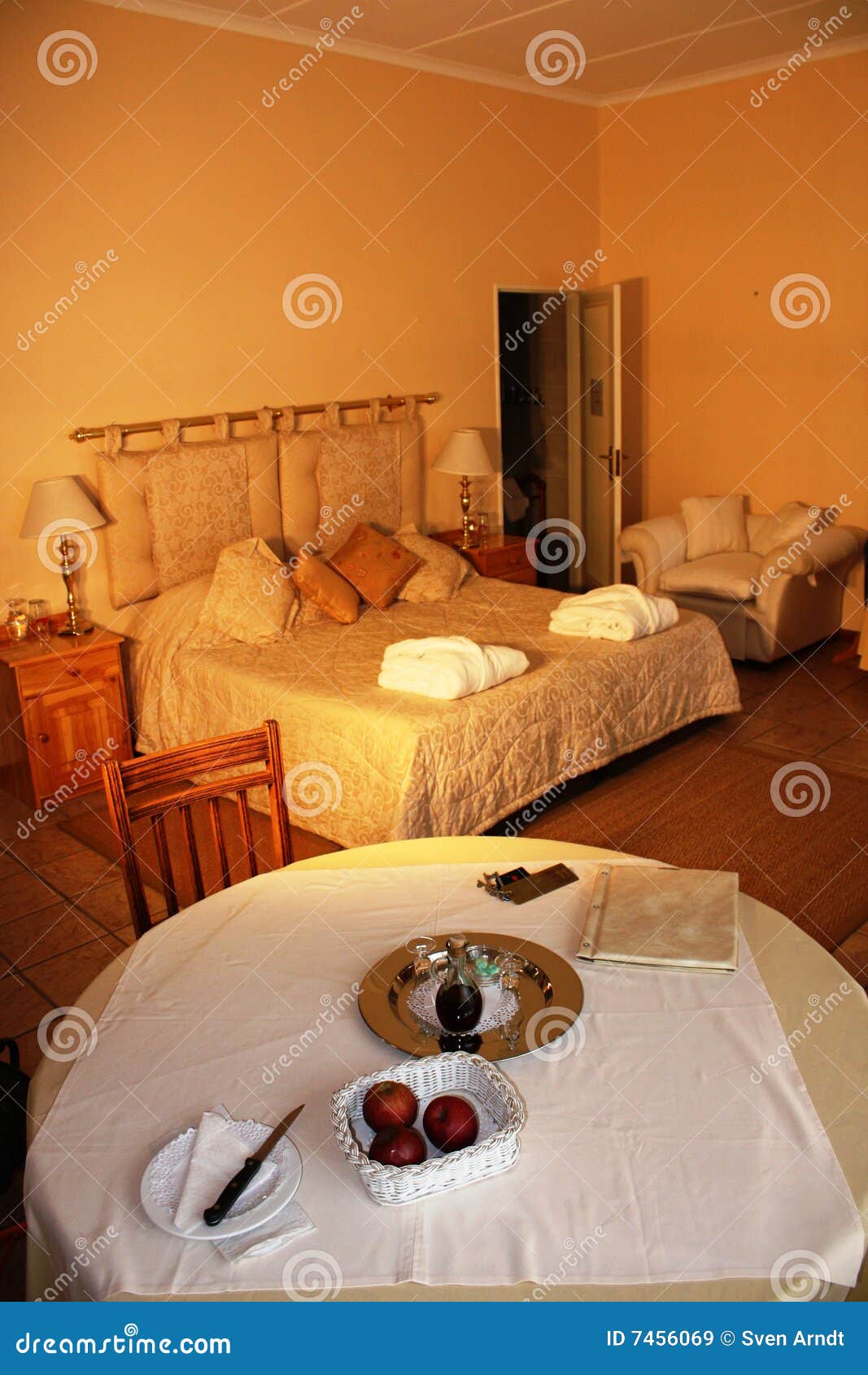 Hotel room with a table stock image. Image of bedroom 7456069