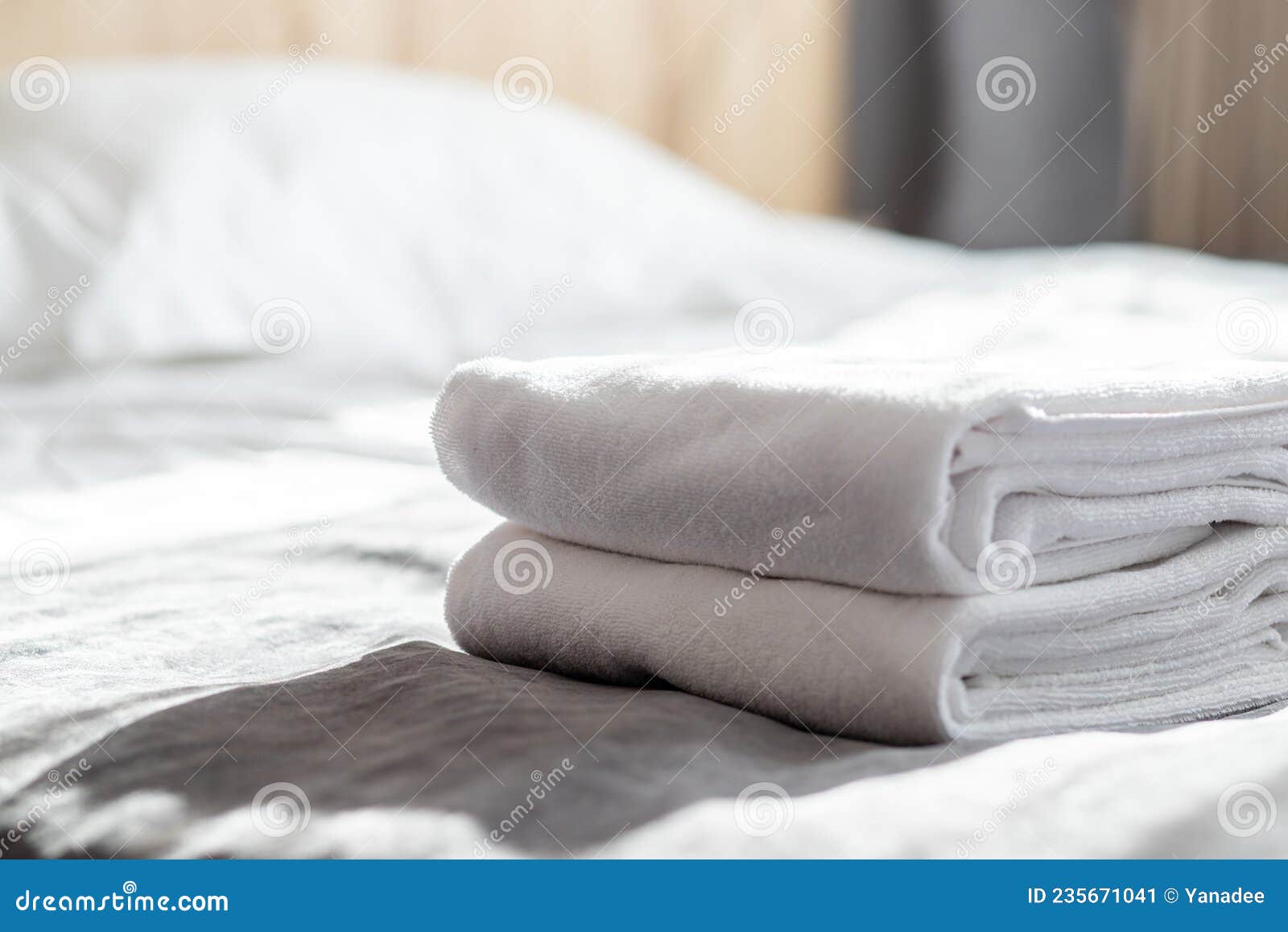 Hotel Service, Clean White Towels on the Bed in the Hotel Room Stock