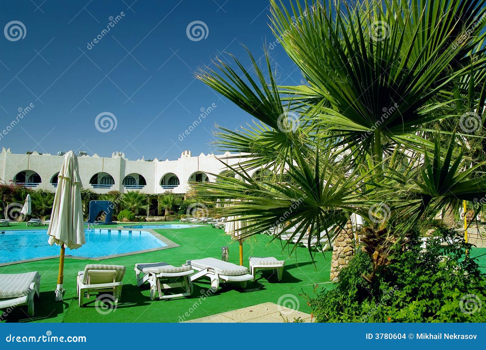 Hotel with swimming pool stock photo. Image of sunlight - 3780604
