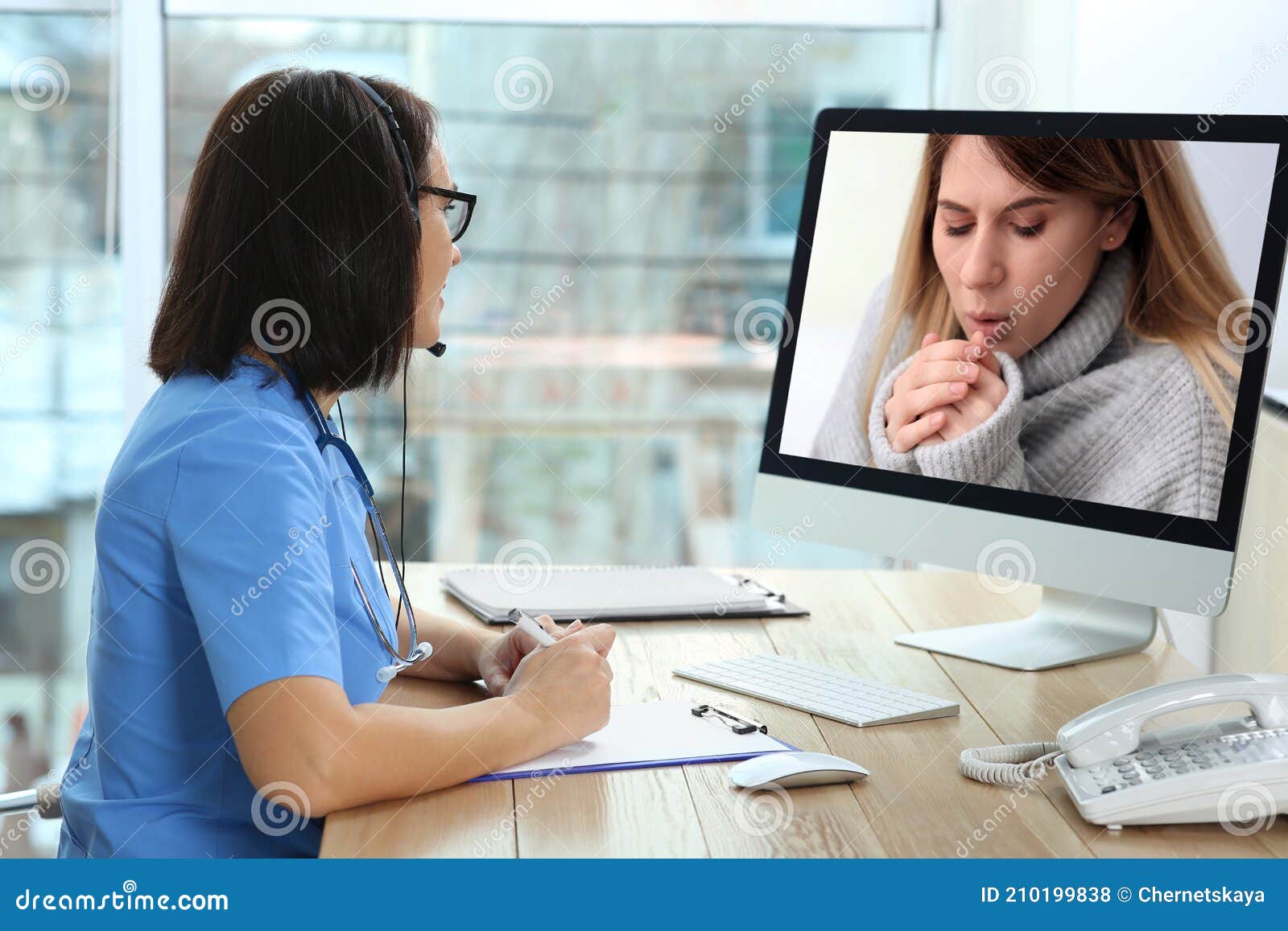 Hotline Service. Doctor Consulting Patient Online Via Computer Indoors