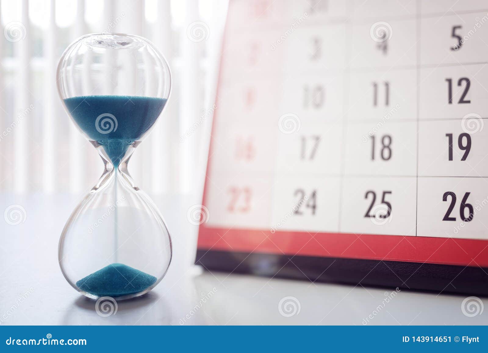 hour glass and calendar important appointment date, schedule and deadline