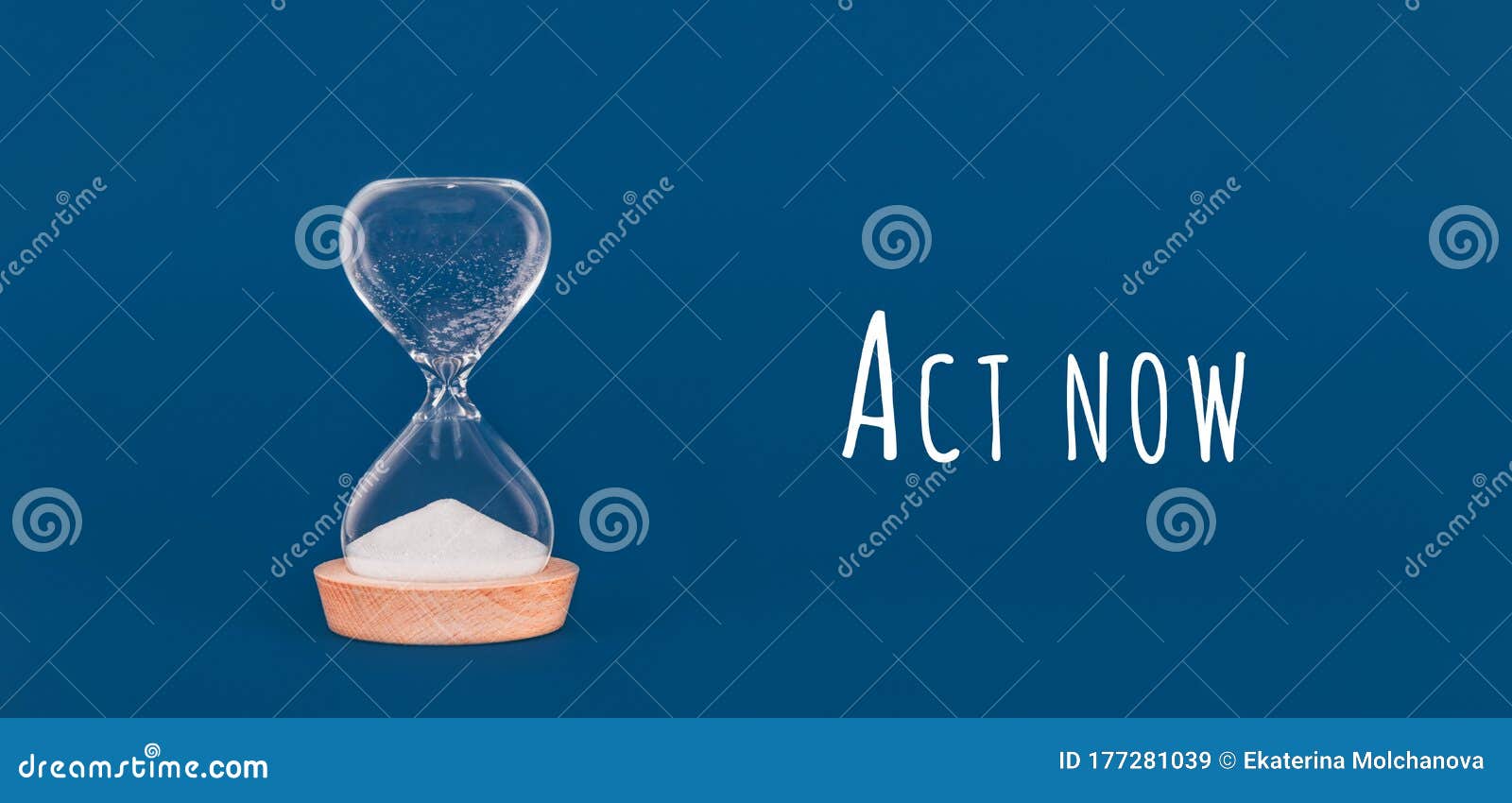 hourglass with the finished sand with act now wording. concept of time and timely actions