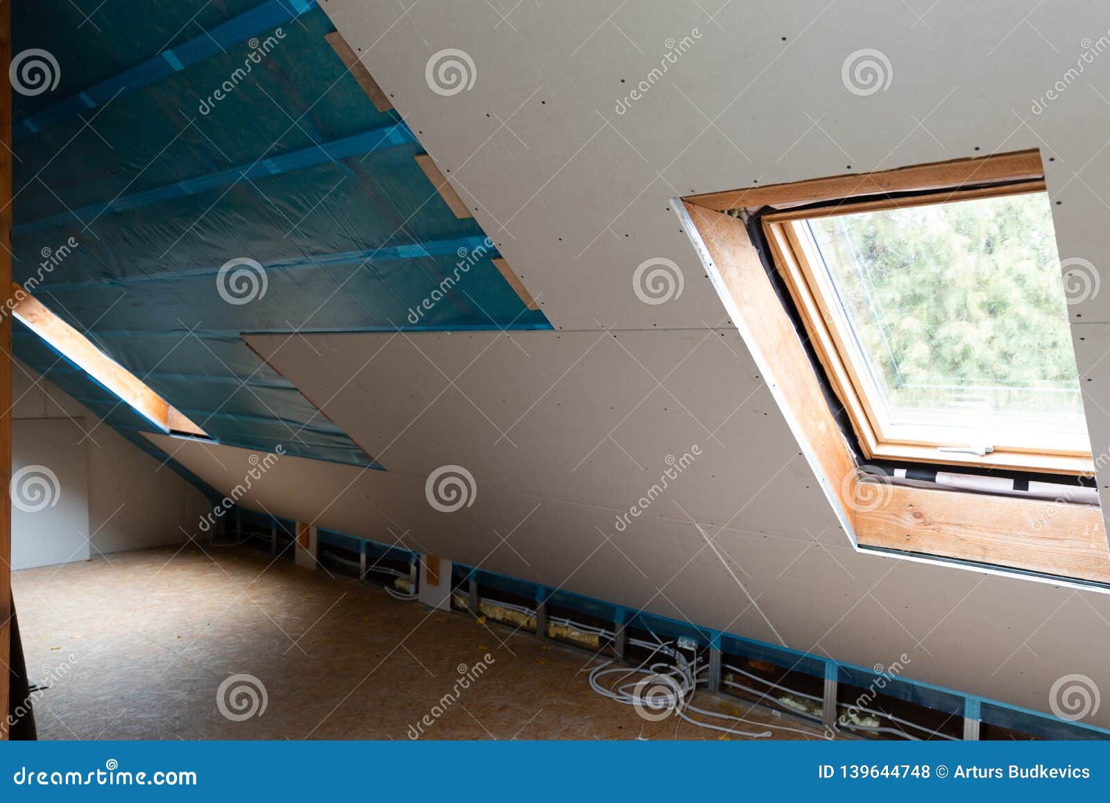 House Attic Insulation and Renovation. Drywall Construction Stock Photo