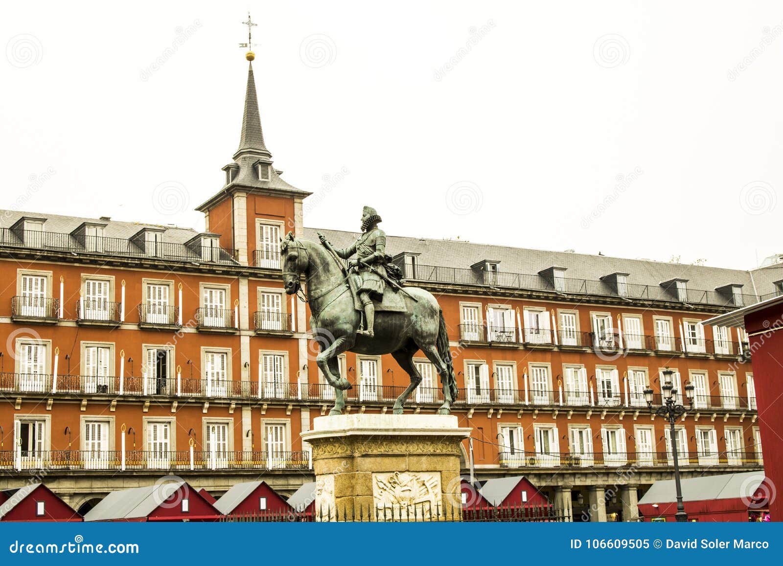 equestrian statue of felipe iii house of the bakery in the background in . madrid