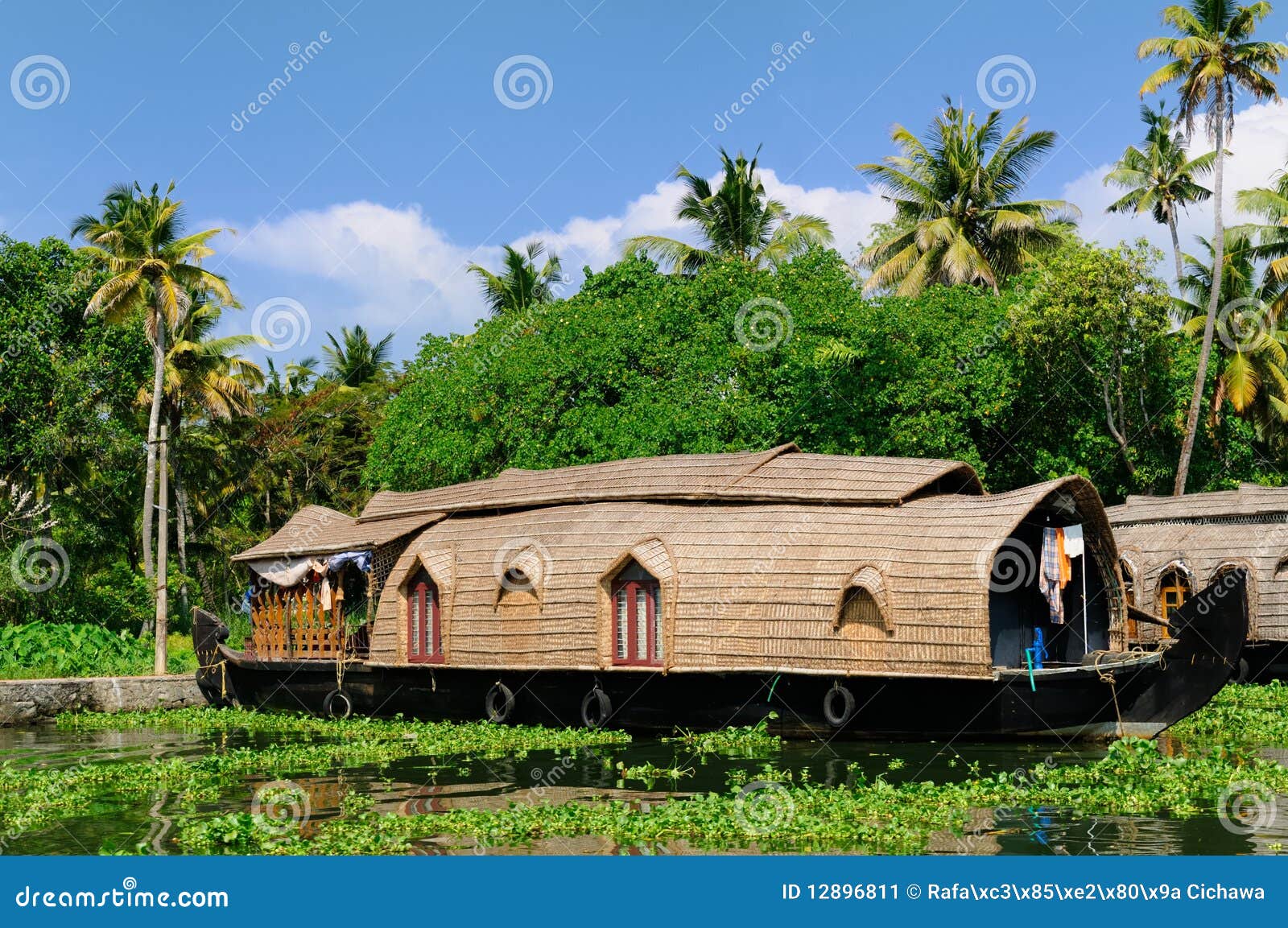  reflection and beautifoull house boat at back waters of Kerala, India