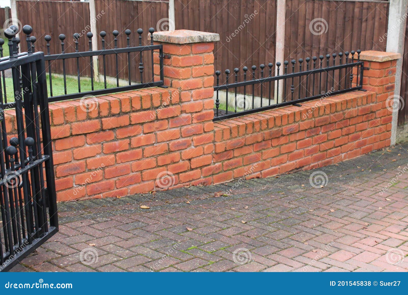 House Boundary Brick Wall with Wrought Iron Fence in between Stock ...