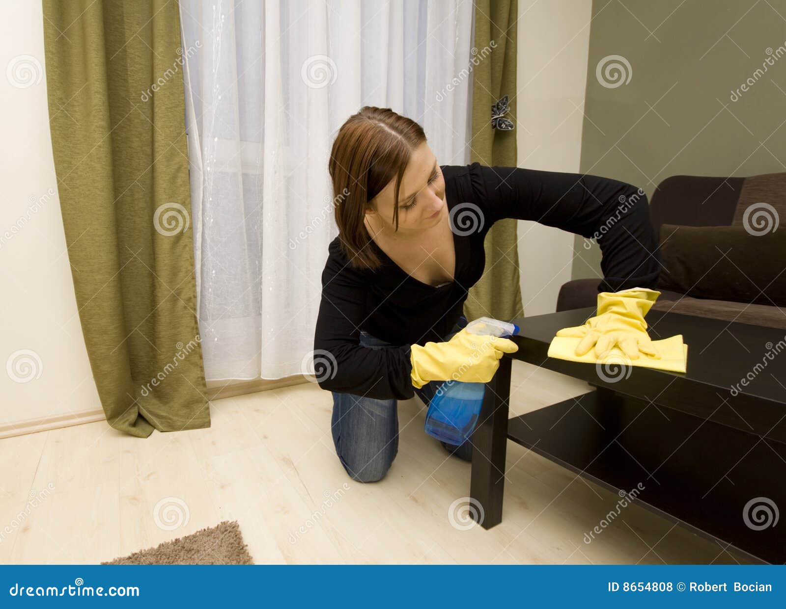 House cleaning. Woman cleaning house in gloves