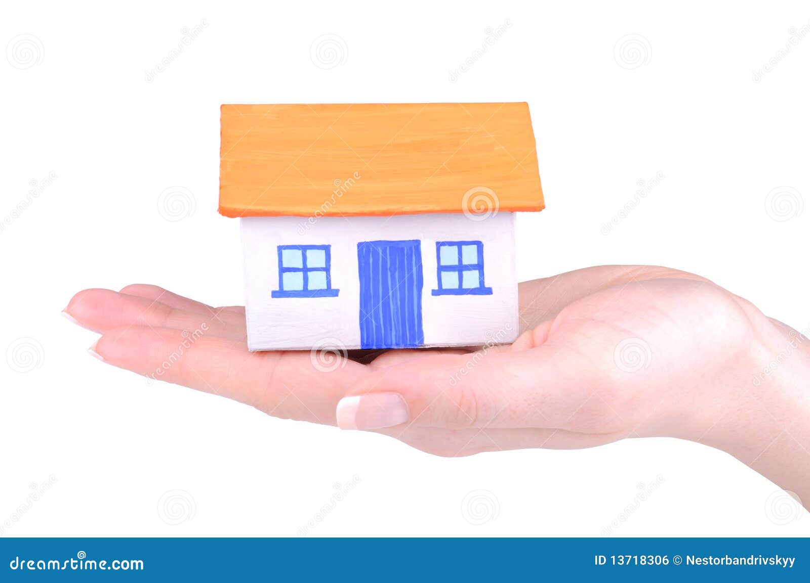 House on hand. Paper house in the young woman hand